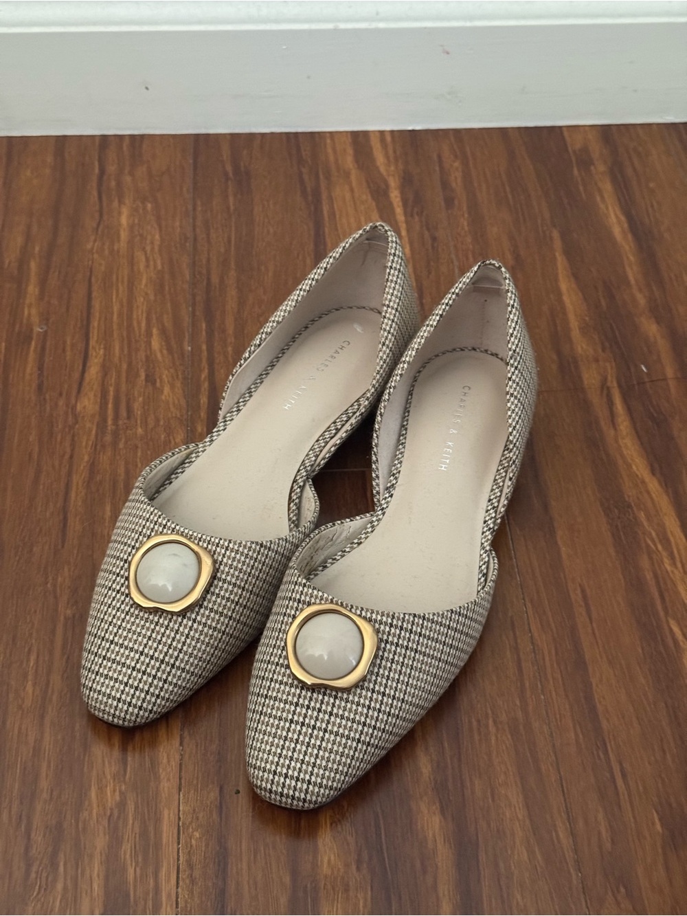 Charles & Keith Beige Houndstooth Pointed Flats with Gold Medallion